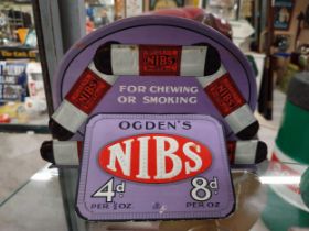 Ogden's Nibs for chewing or smoking cardboard counter showcard. {13 cm H x 19 cm W}.