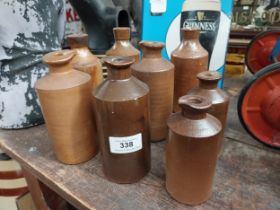 Eight 19th C. stoneware ink bottles. {15 cm H to 10 cm H}.