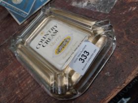 Country Cream glass advertising ashtray. {13 cm H x 16 cm W}.