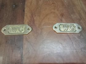 Pair of Brass WC signs {H 4cm x W 10cm }.