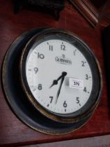 Guinness tin plate advertising clock {26 cm Diam}.