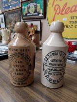 Two 19th C. ceramic ginger beer bottles - M P O'Brien Galteemore and Thwaites Dublin. {22 cm H}.