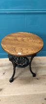 Oak and cast iron pub table. {71 cm H x 60 cm Dia.}