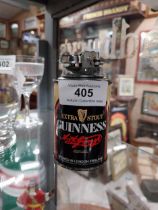 Guinness advertising lighter. {10 cm H x 5 cm Dia.}.