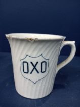 Oxo ceramic advertising cup {H 8cm x W 10cm x D 8cm }.