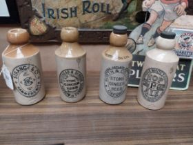 Four 19th C. stoneware ginger beer bottles - Whitehead and Denbigh, Strange and Co, North and Co Ltd