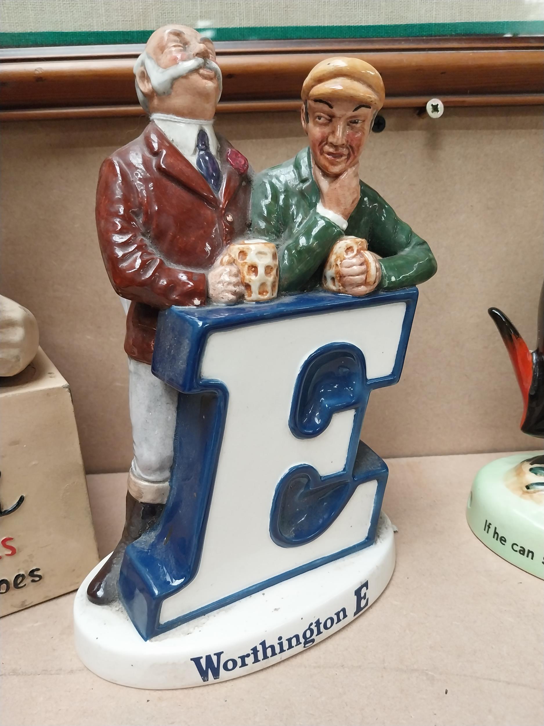 Worthington's Ale E ceramic Beswick advertising figural group. {24 cm H x 15 cm W x 5 cm D}.