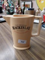 Mackinlays Scotch Whiskey ceramic advertising water jug. {16 cm H x 16 cm W x 6 cm D}.