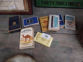 Eight cigarette advertising packets - Camel, piccadilly.