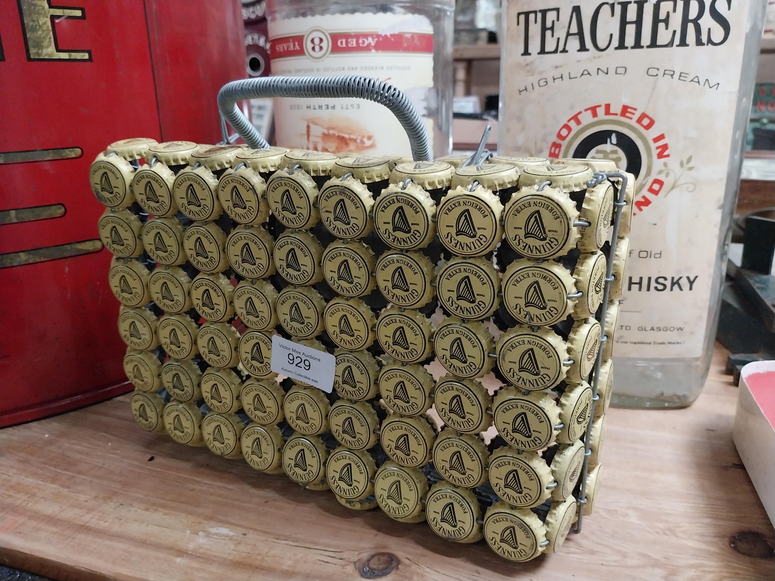 Handbag fashioned from Guinness bottle tops. {23 cm H x 28 cm W x 8 cm D}.