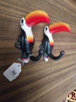 Pair of cast iron Guinness Toucans in the form of coat hangers. {15 cm H x 6 cm W}.