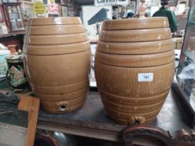 Two stoneware whiskey dispensers. {32 cm H x 24 cm Dia.}.