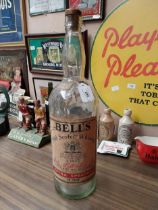 Large Bell's Whiskey advertising bottle. {53 cm H x 16 cm Dia}