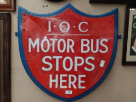 IOC Motor Bus Stops Here enamel and wooden sign in the form of Shield. {59 cm H x 57 cm W}