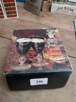 Two Guinness Irish whiskey glasses in original box. {16 cm H x 6 cm Dia.}.