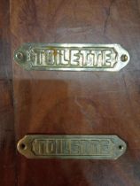 Pair of brass Toilette signs {H 4cm x W 15cm }.