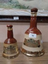 Bells Scotch Whiskey advertising bottles. {25 cm H x 15 cm Dia} and {17 cm H x 9 cm Dia.}.