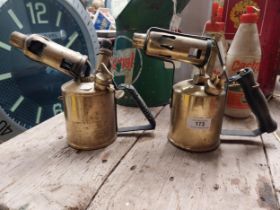 Two 20th C. brass and metal blow torches. {20 cm H}