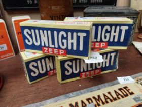 Four packets of Sunlight Soap. {7 cm H x 16 cm W x 4 cm D}.