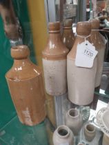 Three 19th C. stoneware ginger beer bottles. {20 cm H}