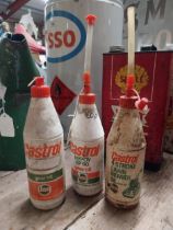 Three 1970's Castol oil plastic bottles. {25 cm H x 7 cm Dia.}.