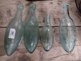 Four 19th C. glass torpedo bottles - Two R Thwaites, Parkinsons Macclesfield and Pitts Warbourton