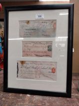 Three framed cheques Ulster Bank Ltd 1915, The Provincial Bank Of Ireland 1929 and The Royal Bank of