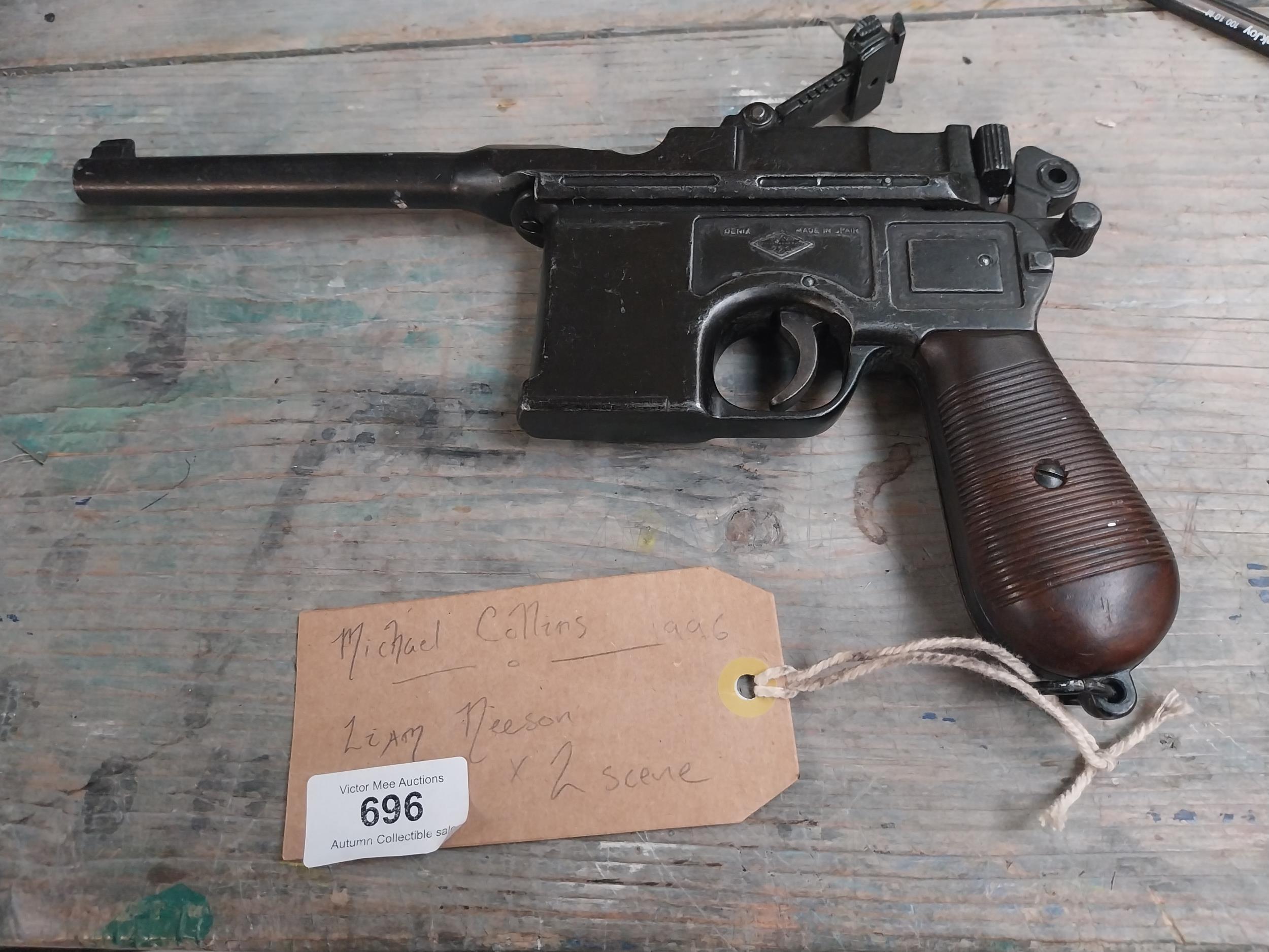 Mauser C96 gun used by Liam Neeson in Michael Collins film. {15 cm H x 30 cm W}.