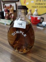 Dimple Whiskey Bottle with contents. {16 cm H x 9 cm W x 9 cm D}.
