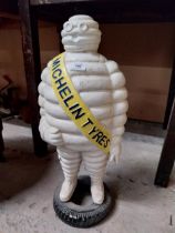 Cast iron Michelin Man advertising model. {62 cm H x 27 cm W x 20 cm D}.