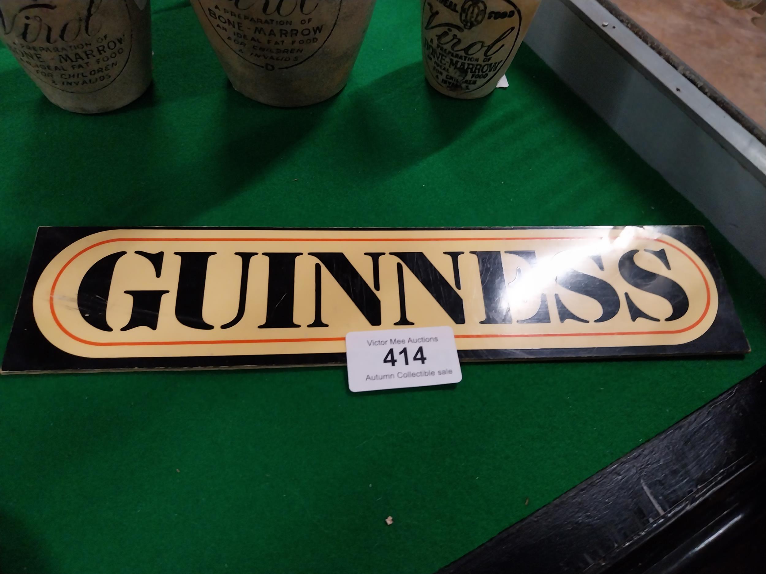 Guinness stick on advertising sign. {5 cm H x 16 cm W}.