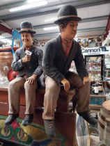 Stan Laurel and Charlie Chaplin moulded resin figures. {59 cm H x 18 cm W x 30 cm D} and {63 cm H