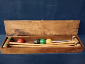 Cased croquet set {H 12cm x W 87cm x D 18cm }.