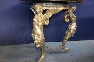 Cast iron pub table surmounted with three angel figures and marble top damaged {H 84cm x D 84cm}.