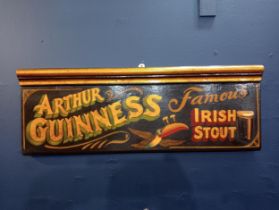 Arthur Guinness Famous Irish stout painted advertising board. {H 25cm x W 71cm x D 5cm}.