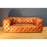 Deep button leather Chesterfield sofa {H 69cm x W 195cm x D 106cm}.