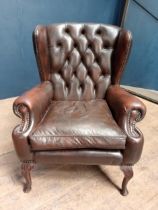 20th C. brown leather wing back armchair on Queen Ann legs. {H 100cm x W 75cm x D 70cm }.