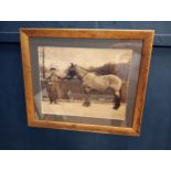 Framed black and white print of man and horse {H 56cm x W 66cm}.