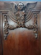 19th C. oak panel door decorated with cherubs and foliage {H 222cm x D 13cm x W 95cm}.