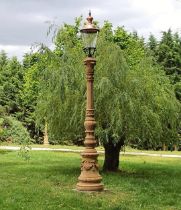 Pair of good quality moulded sandstone avenue lamps with copper lights {330 cm H x 50 cm Dia.}.(