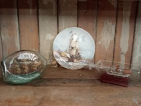 Two glass ship bottles and plate. {H 20cm down to H9 cm }.