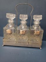 Silver plate tantalus with three cut glass decanters with Gin Whisky and Port plaques {H 30cm x W