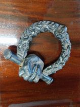 19th C. cast iron door knocker decorated with fist and lion mask {18 cm H x 15 cm W}.