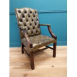 Deep buttoned leather Gainsborough arm chair in the Georgian style {105 cm H x 60 cm W x 65 cm D}.
