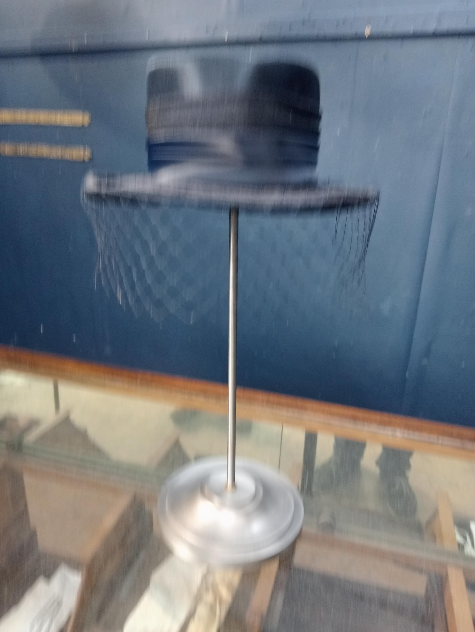 1930's Metal hat stand with ladies hat. {H 50cm x W 28cm x D 34cm }.