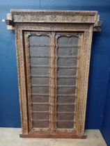 Carved wooden Moroccan door with metal panels and studding {H 180cm x W 120cm x D 40cm }.