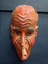 Hand carved wooden mask with blowpipe {H 53cm x W 27cm x D 15cm }.
