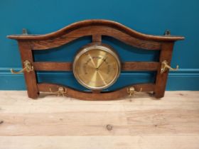 1940s oak wall hanging hat and coat stand with central brass faced barometer {42 cm H x 77 cm W x