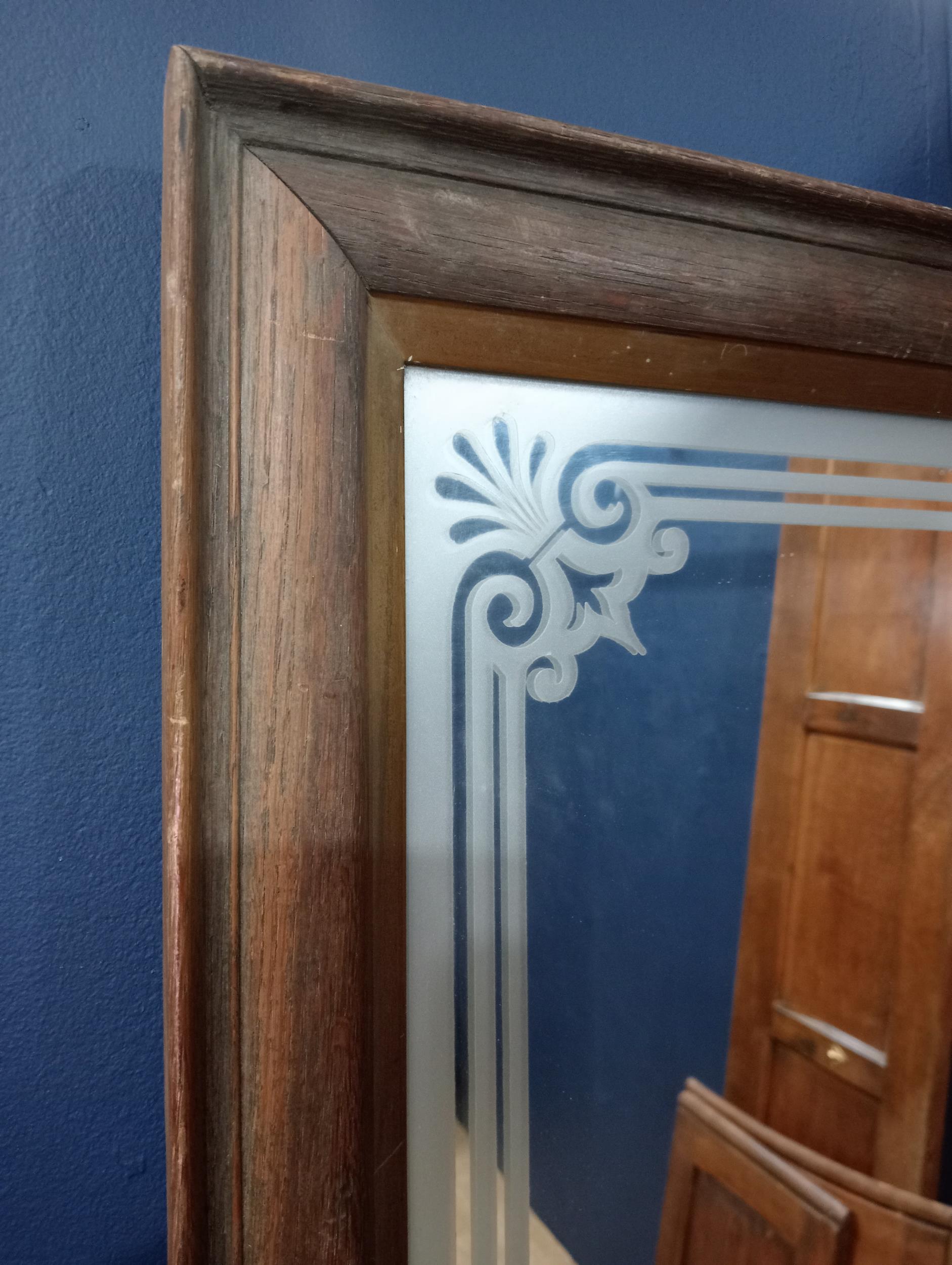 Etched wall mirror in oak frame {H 83cm x W 65cm }. - Image 2 of 2