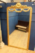 French gilt wood mirror with swags and floral decoration {H 235cm x W 120cm x D 6cm}.